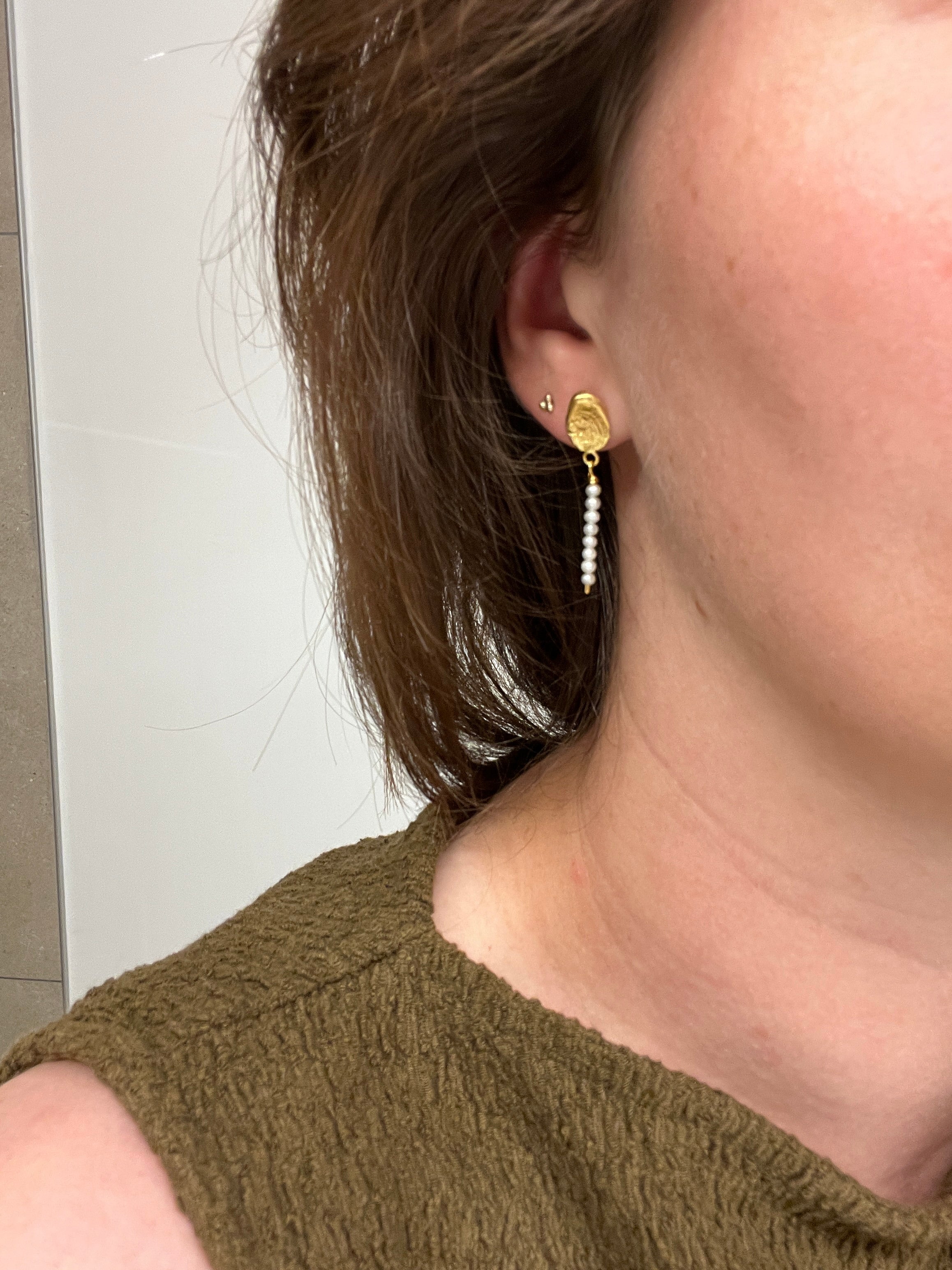 wearing the 18kt gold plated stud earring